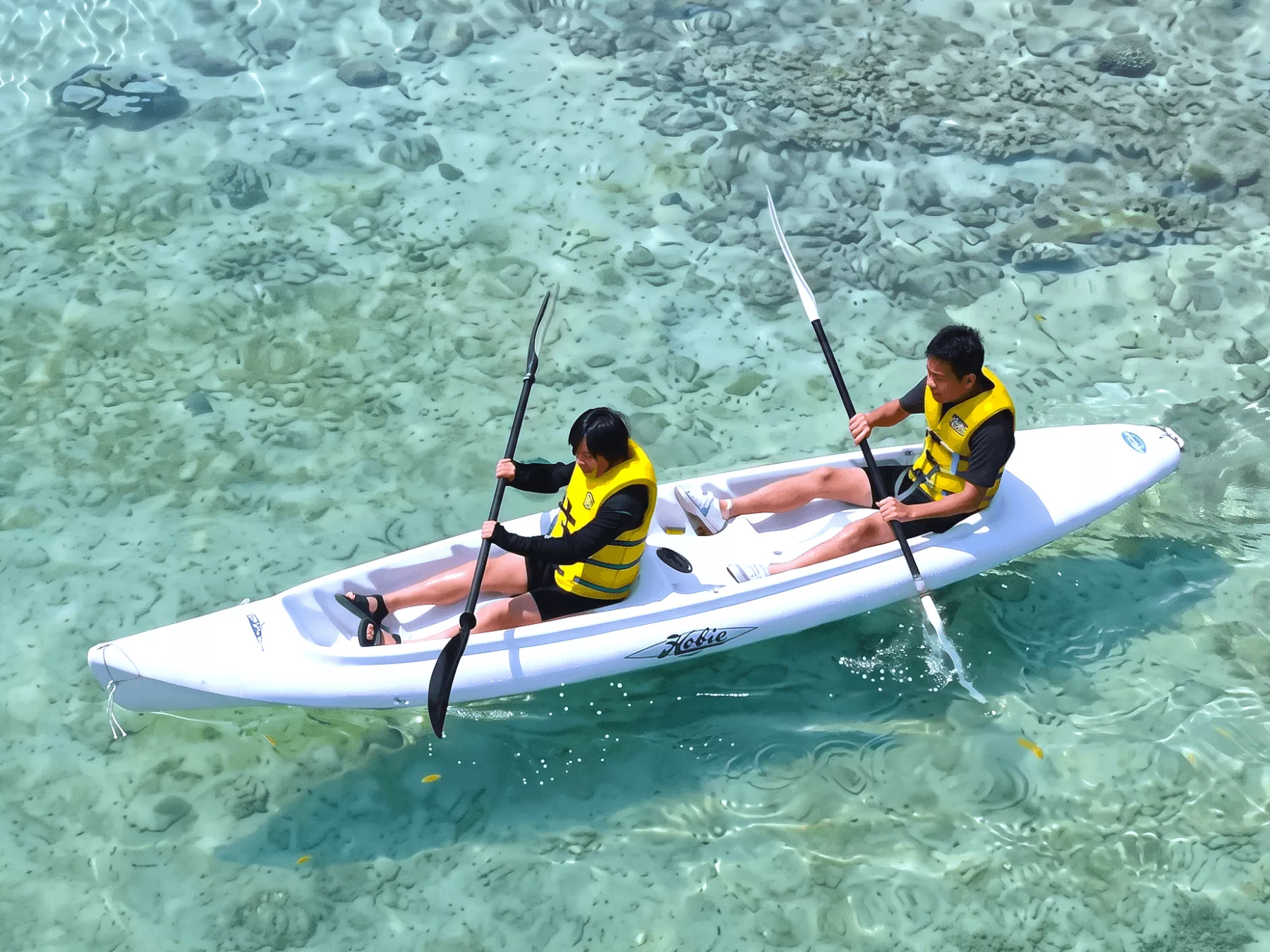 Popular banana boat experience speeding through the beautiful ocean of Onna Village