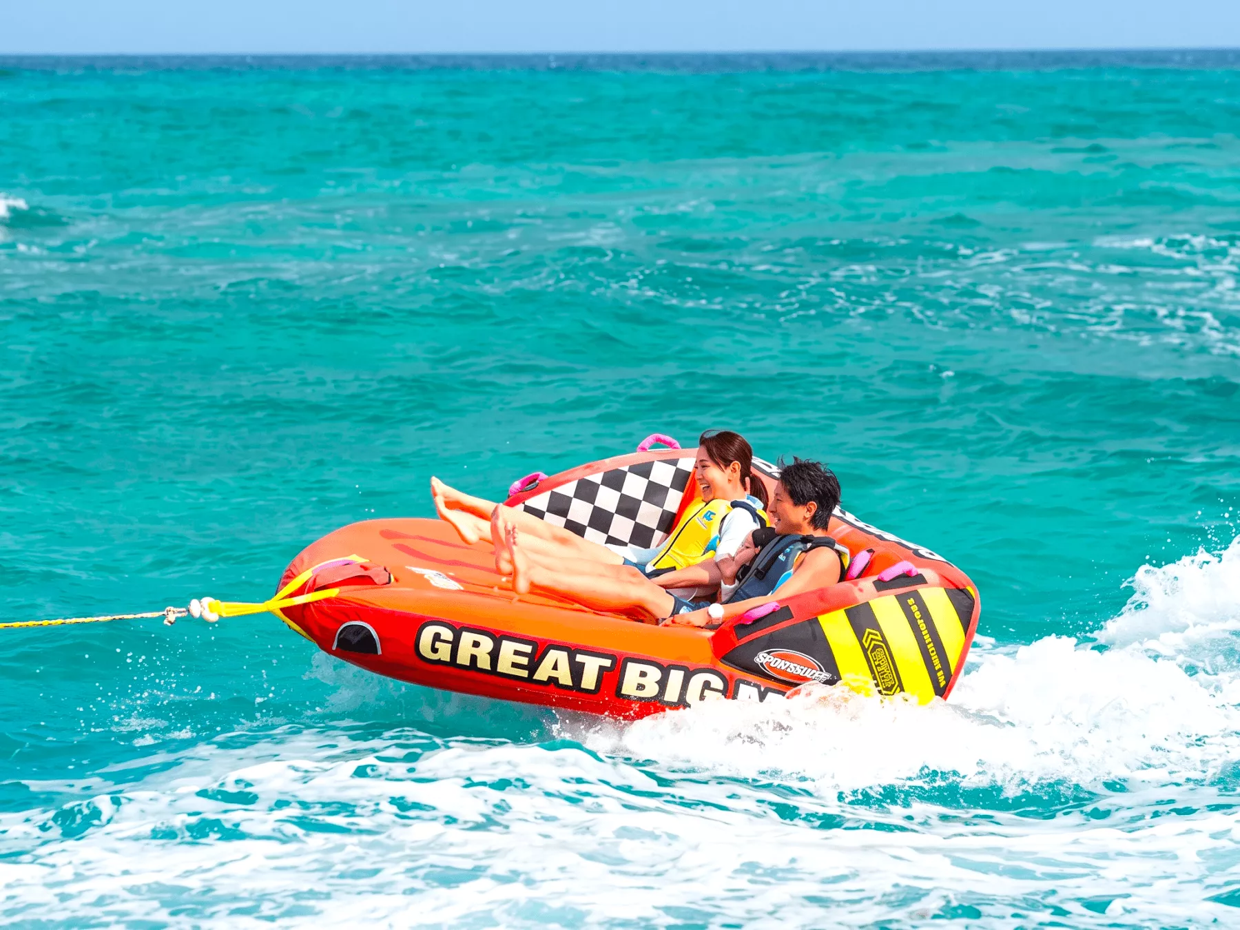 Popular marine activity Big Marble speeding through the beautiful ocean of Onna Village, Okinawa