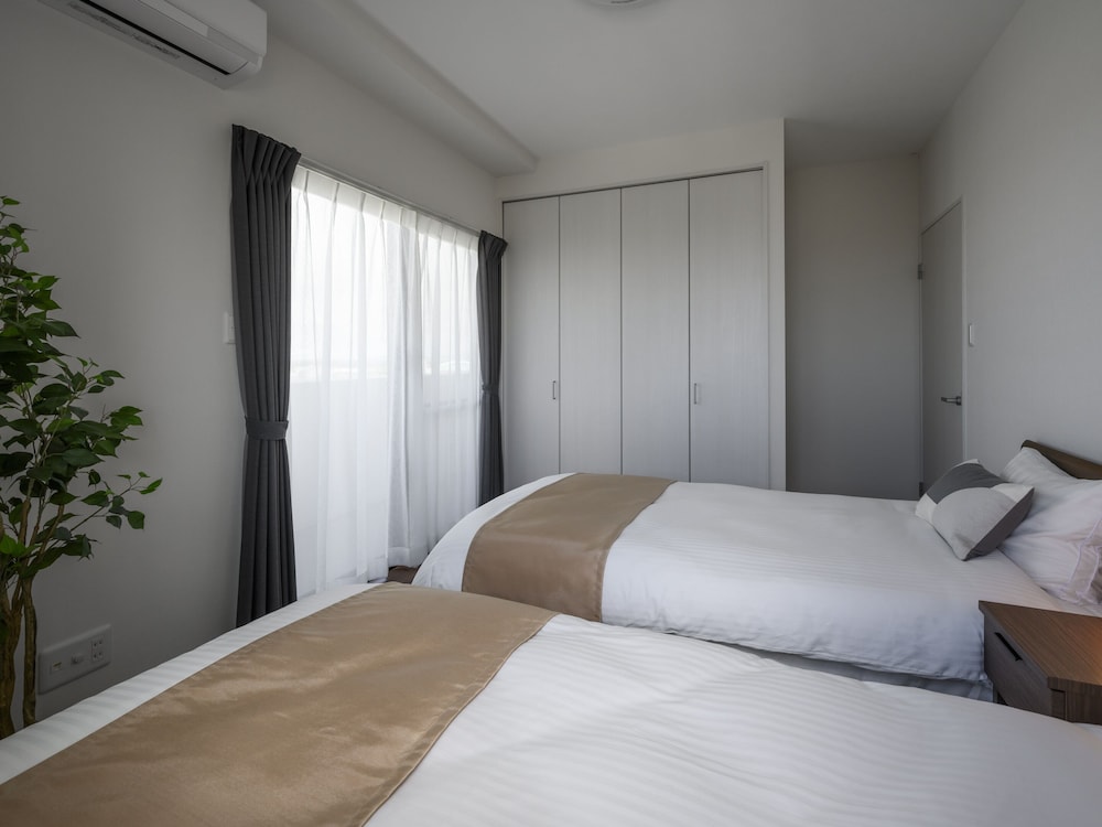 エグゼクティブ アパートメント 3 ベッドルーム キッチン シティビュー 客室4 | &Monde.Okinawa Arena Condominium