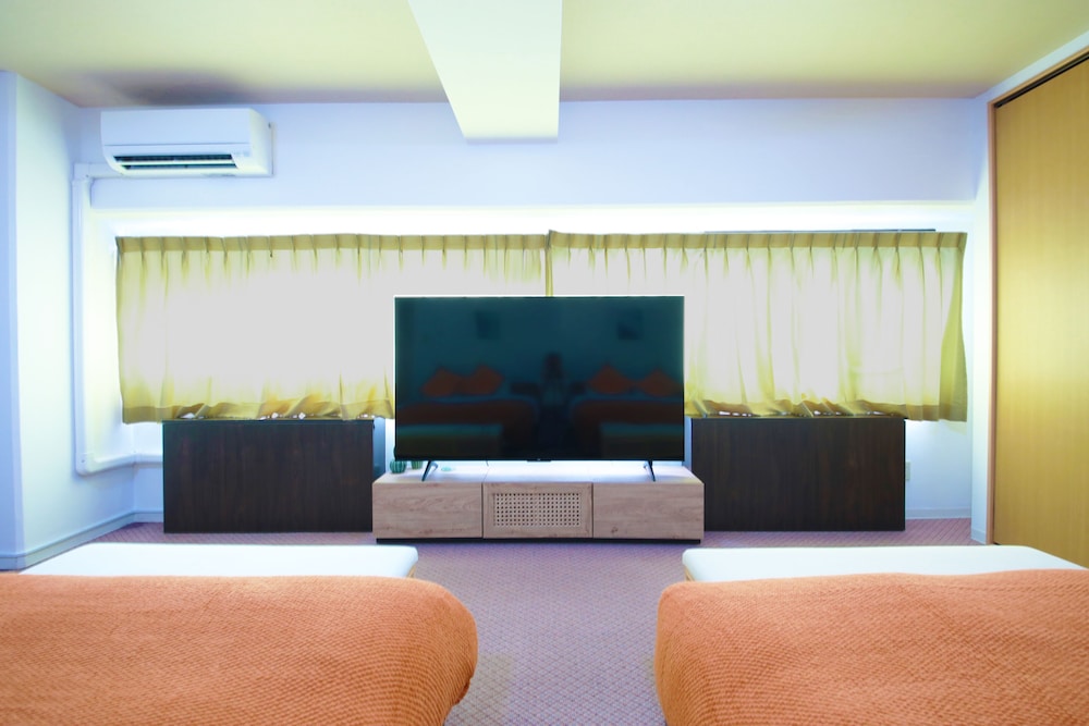 ジュニアスイートルーム　ダブルベッド2台付　禁煙　清掃料金別　連泊時の清掃なし 客室1 | 宮崎マンゴーホテル