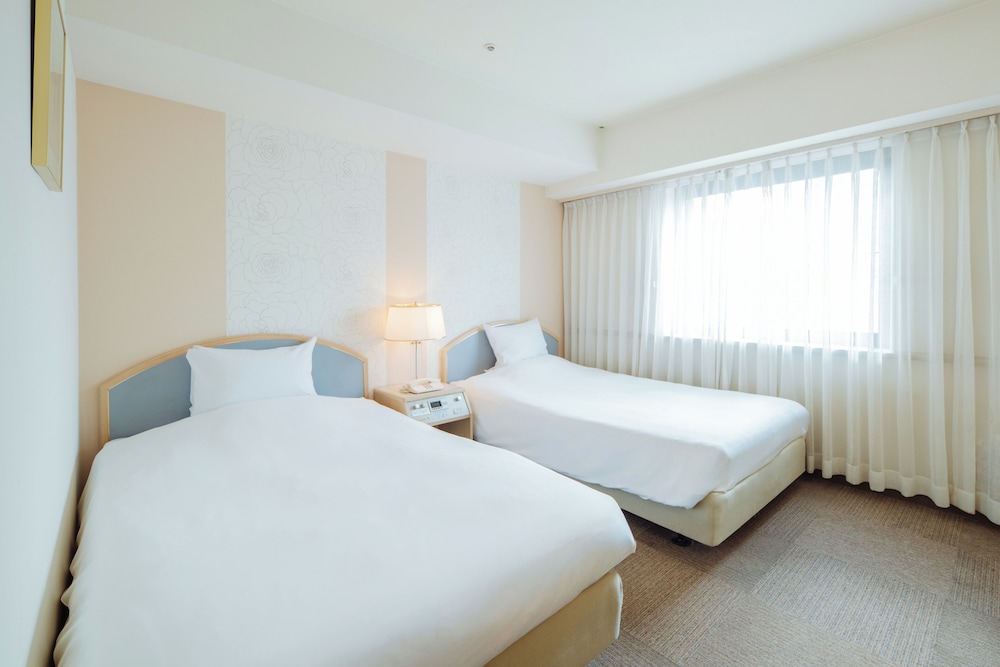 ツインルーム 喫煙可 (17.9 平米) 客室1 | ネストホテル松山