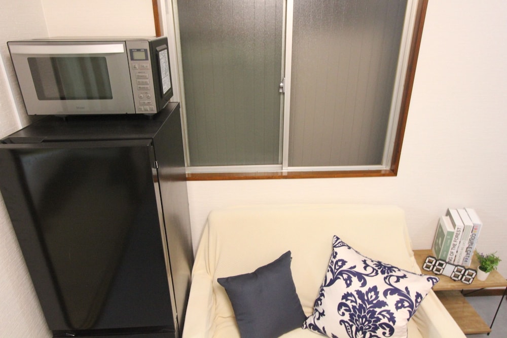 ビジネス トリプルルーム ベッド (複数台) 禁煙 (302) リビング エリア1 | LUANAホテル 新中野駅前