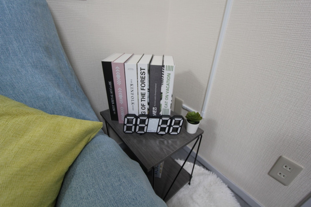 ビジネス トリプルルーム ベッド (複数台) 禁煙 (301) リビング エリア1 | LUANAホテル 新中野駅前