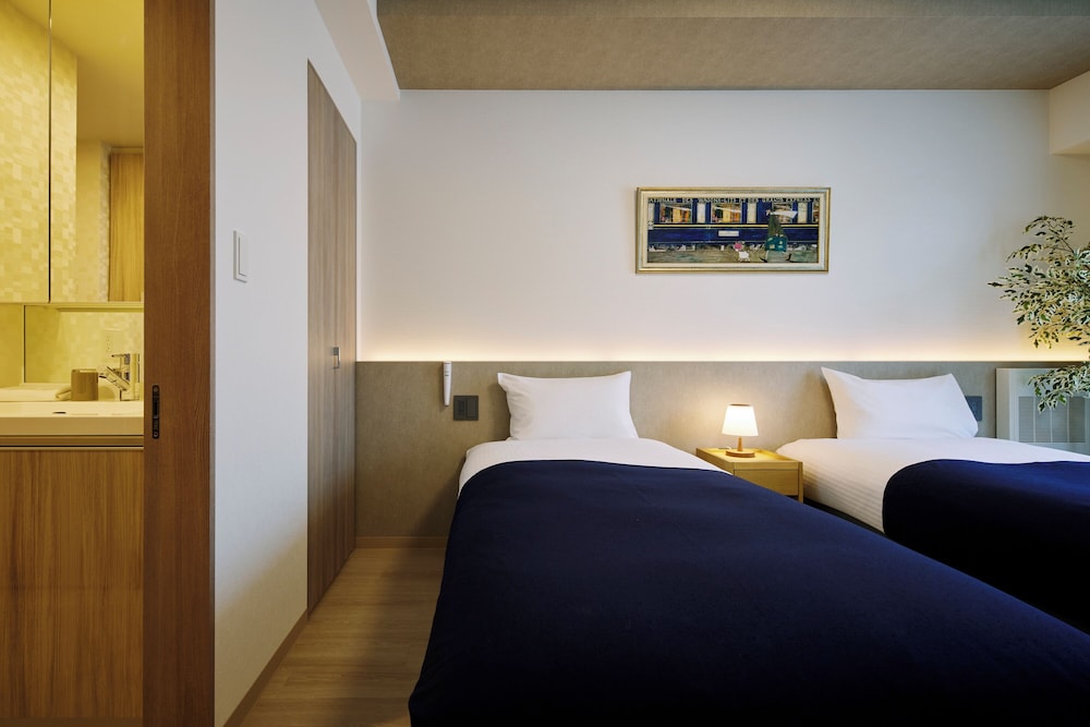 デラックス アパートメント 客室2 | Minn 北広島 Station East