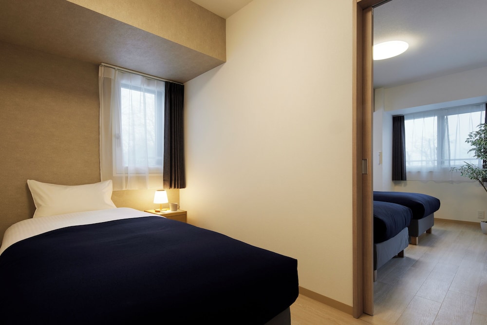 エグゼクティブ アパートメント 2 ベッドルーム サウナ 客室1 | Minn 北広島 Station East