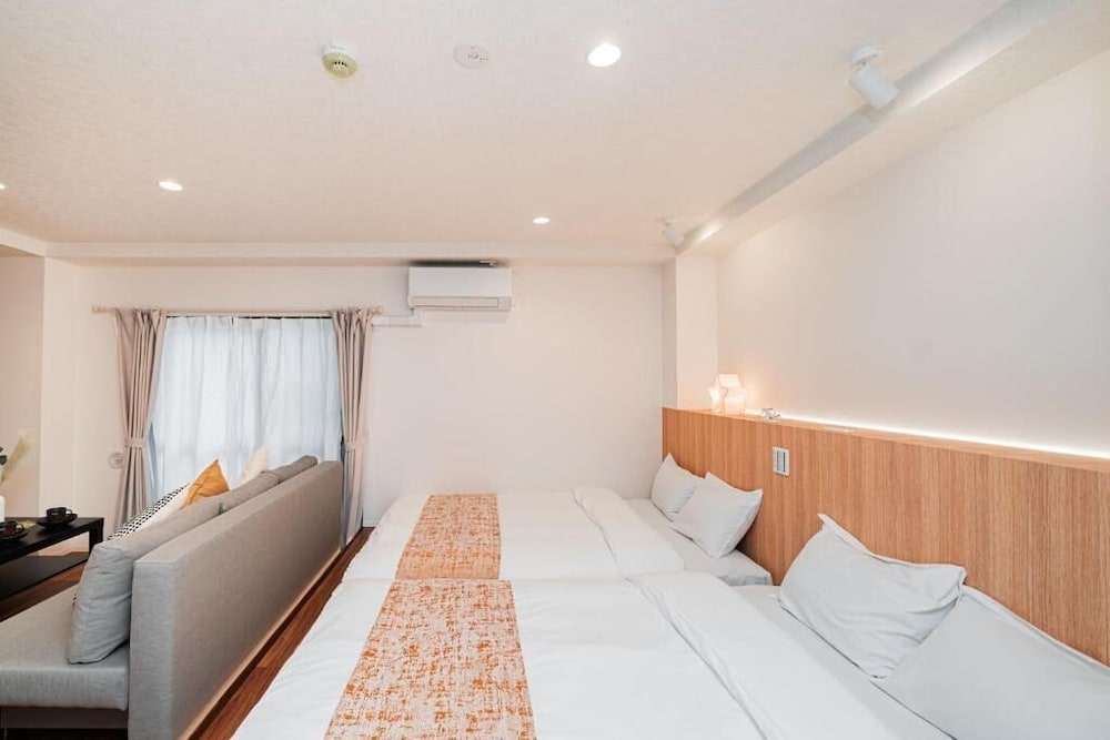 シニア アパートメント ベッド (複数台) シティビュー 客室3 | SAIEI HOTEL