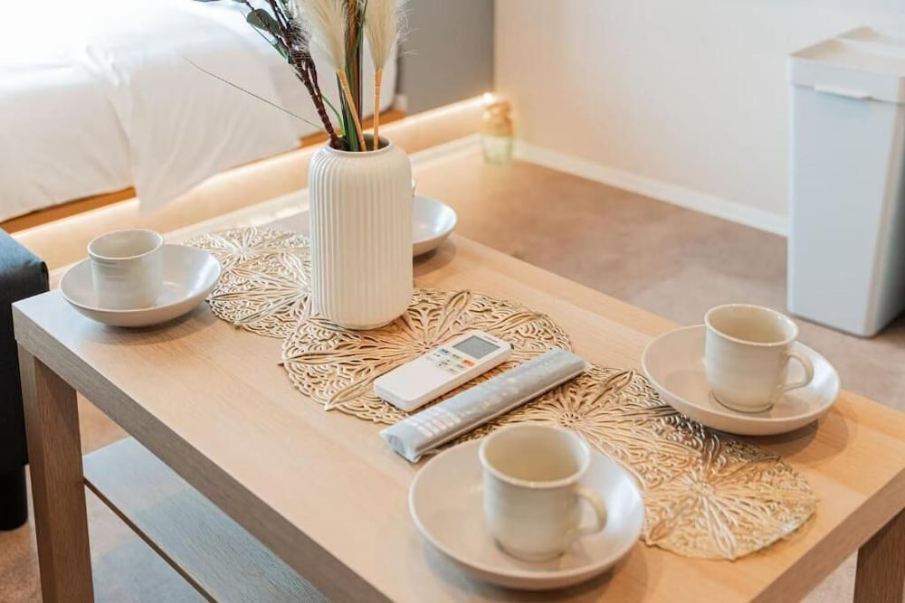 スタンダード アパートメント ベッド (複数台) シティビュー リビング エリア4 | SAIEI HOTEL