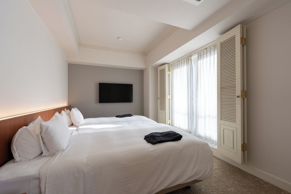 デラックス ツインルーム ベッド (複数台) コーナー 客室1 | セトレグラバーズハウス長崎