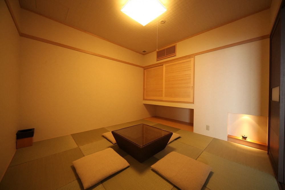 プレミアムスイートルーム 露天風呂付き (TYPE K) リビングルーム0 | AMANE RESORT SEIKAI