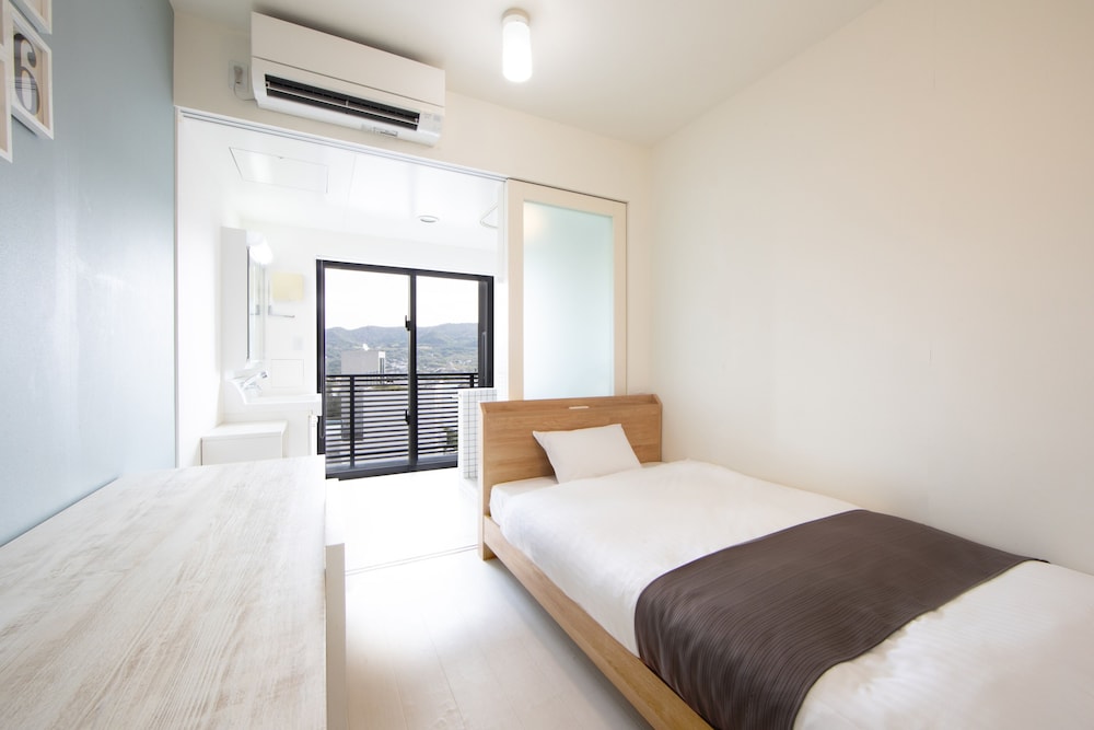シングルルーム セミダブルベッド 1 台 (チェックイン時間15時~18時) | HOTEL E-horizon Resort コンドミニアム瀬底
