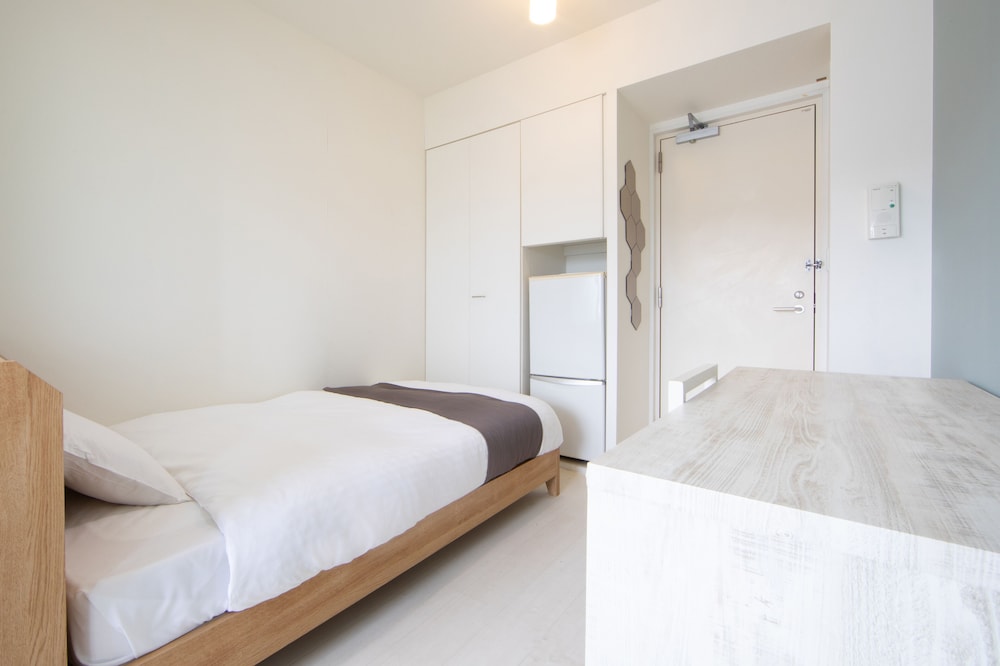 シングルルーム セミダブルベッド 1 台 (チェックイン時間15時~18時) 客室1 | HOTEL E-horizon Resort コンドミニアム瀬底