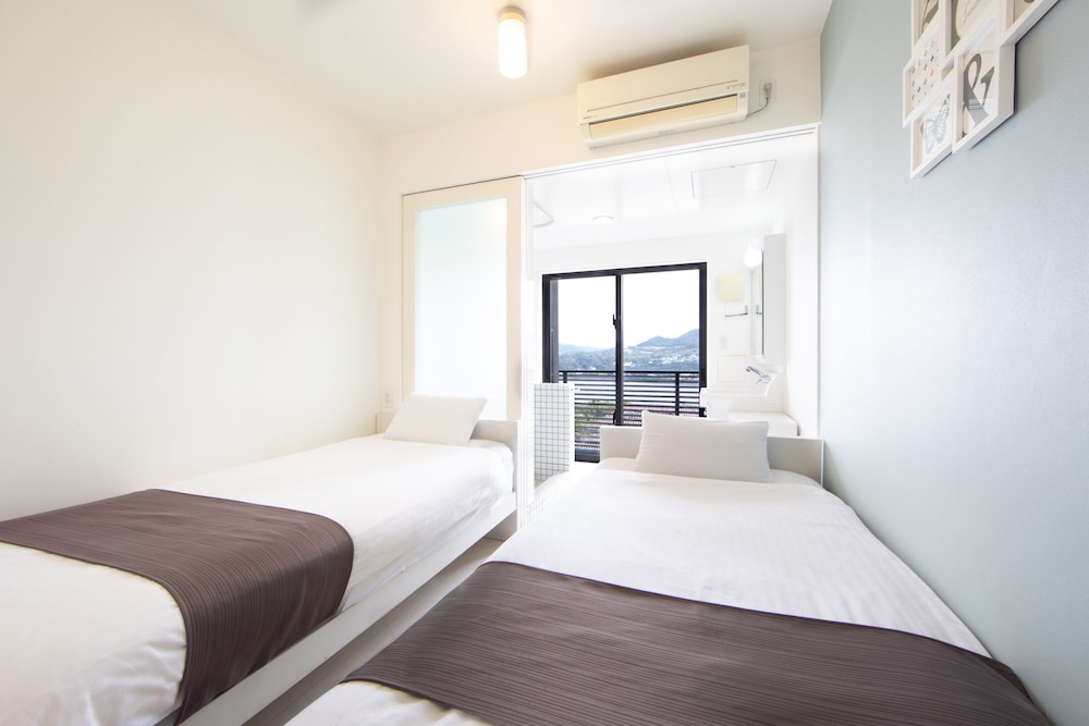 ツインルーム オーシャンビュー (チェックイン時間15時~18時) | HOTEL E-horizon Resort コンドミニアム瀬底