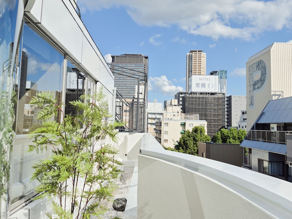 デラックス スタジオ クイーンベッド 2 台 簡易キッチン シティビュー 部屋からの景観0 | UH Suite Namba Station The Spa