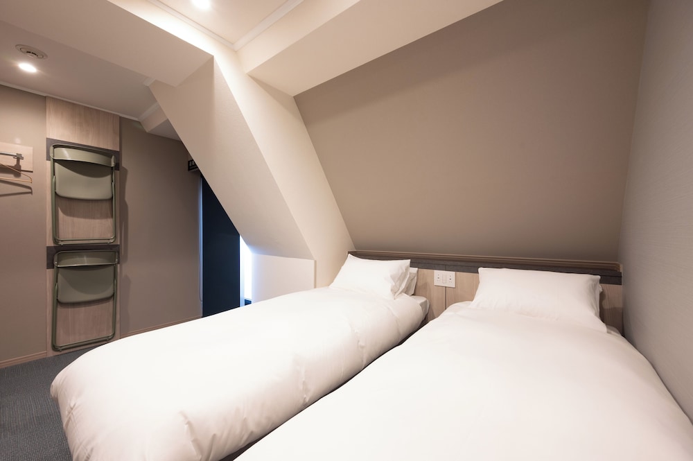 スタンダード ダブルまたはツインルーム 客室2 | EISEI STAY Ikebukuro Nishi