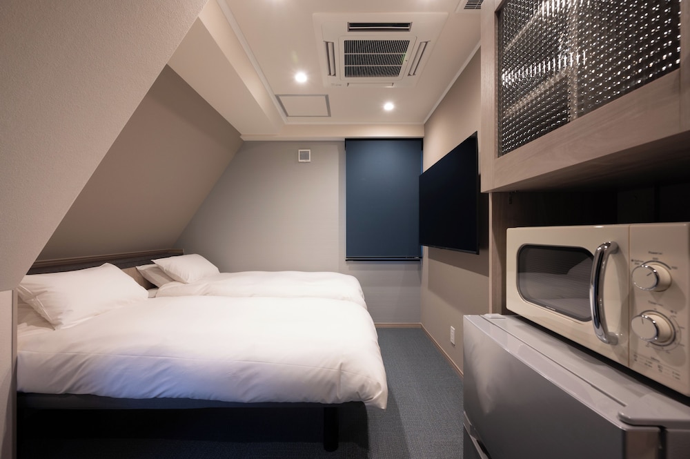 スタンダード ダブルまたはツインルーム 客室1 | EISEI STAY Ikebukuro Nishi