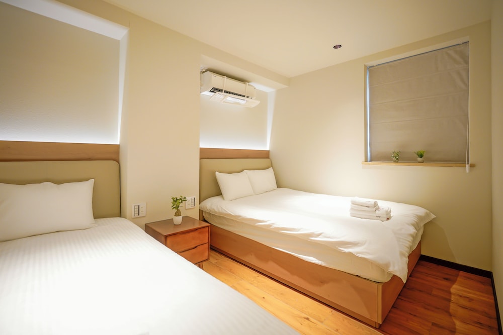 デラックス スイート 2 ベッドルーム 専用バスルーム シティビュー 客室5 | 中野ワールドホテル