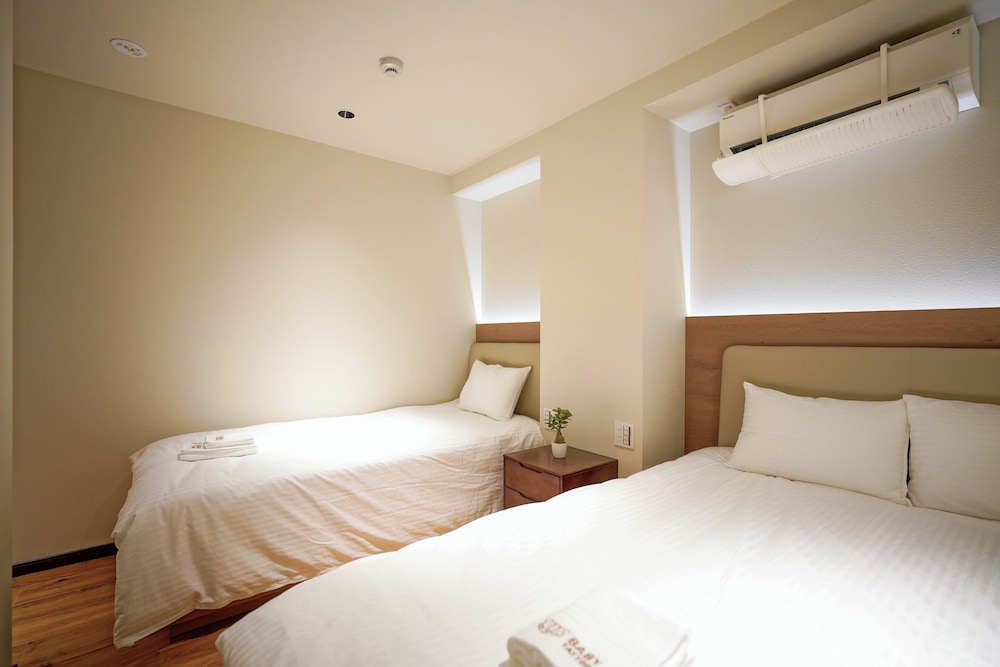 デラックス スイート 2 ベッドルーム 専用バスルーム シティビュー 客室3 | 中野ワールドホテル