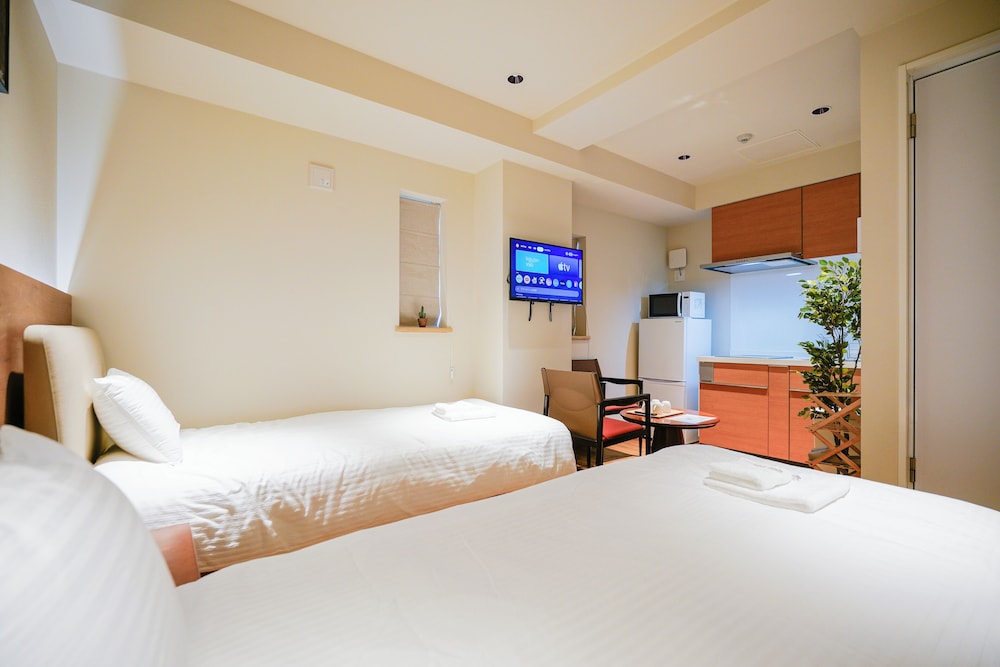 ベーシック ツインルーム シングルベッド 2 台 禁煙 専用バスルーム 客室1 | 中野ワールドホテル