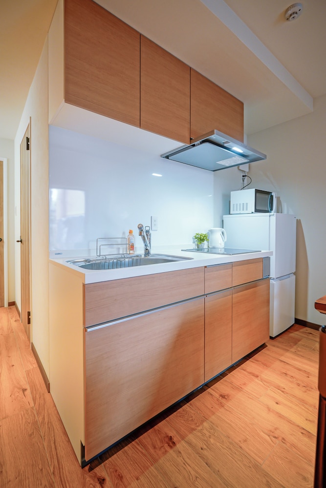 デラックス スイート 2 ベッドルーム 専用バスルーム シティビュー 専用キッチン3 | 中野ワールドホテル