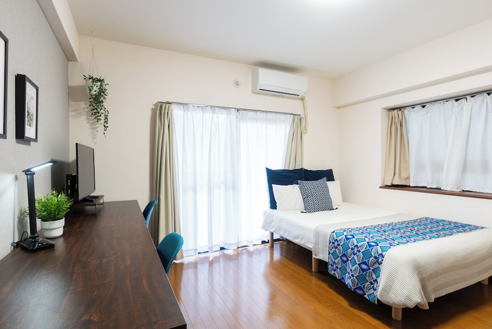 ダブルルーム バルコニー リビング エリア1 | グランデエス　天神