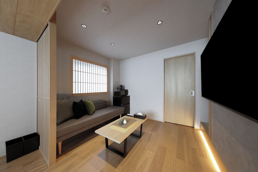 デラックス スタジオ リビング エリア0 | グレイスステイ広島平和公園