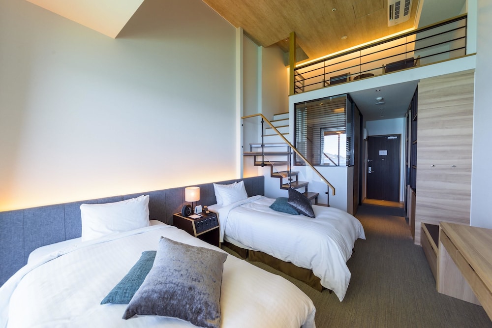 エグゼクティブ ロフト シングルベッド 2 台 禁煙 オーシャンフロント (with Extra Bed) 客室1 | ベストウェスタン沖縄幸喜ビーチ