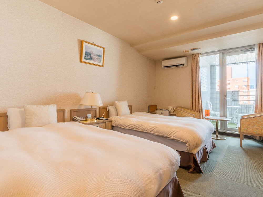 ツインルーム 禁煙 (バルコニーでのみ喫煙可) | ホテル ニューセンチュリー