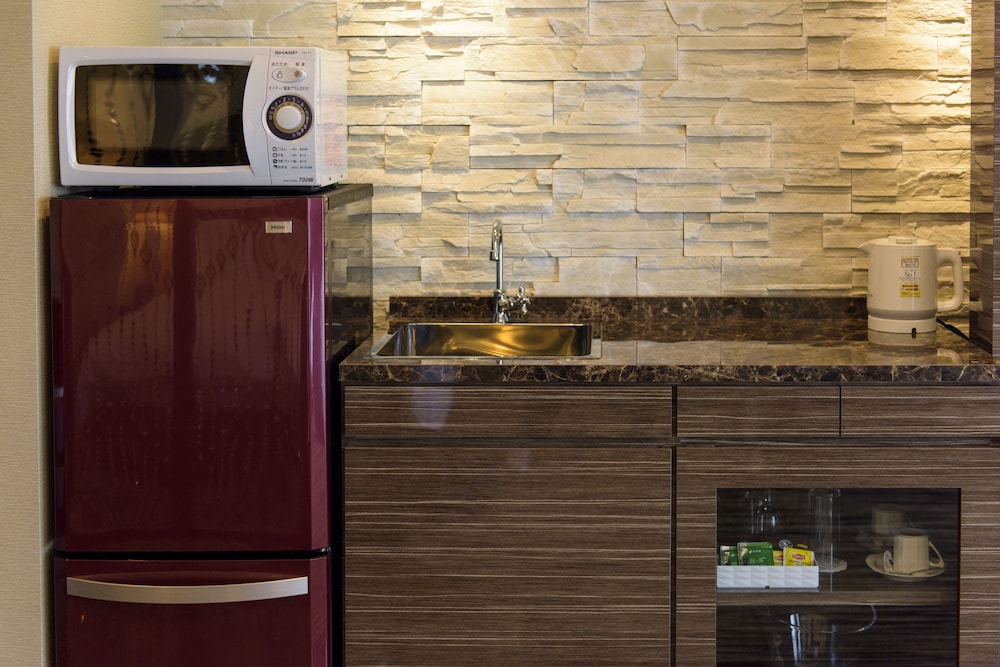 エグゼクティブ ルーム クイーンベッド 1 台 バルコニー 客室の設備とサービス7 | シークレット ハウス牧志