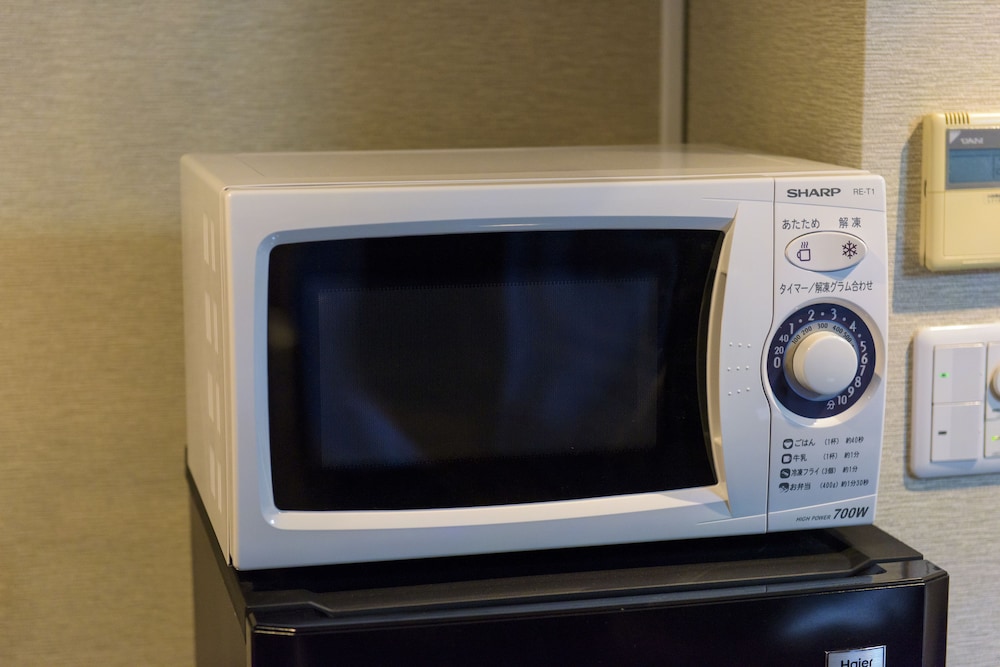 エグゼクティブ ルーム クイーンベッド 1 台 バルコニー 客室の設備とサービス2 | シークレット ハウス牧志