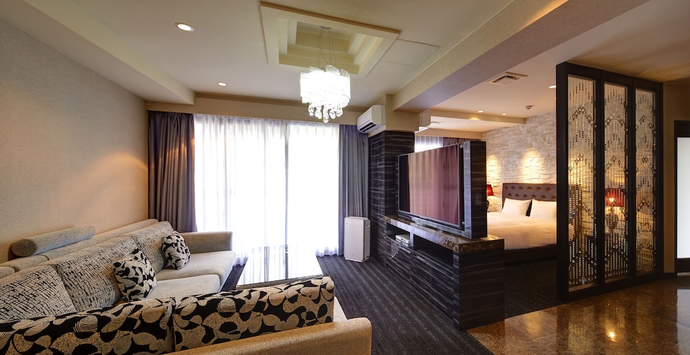 エグゼクティブ ルーム クイーンベッド 1 台 バルコニー | シークレット ハウス牧志