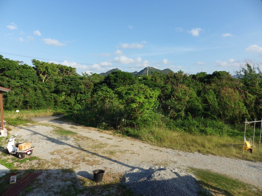 1号店のエクストラウッドデッキタイプ (ダブルベッド2台/3名以降はお布団配置) 部屋からの景観0 | 美ら海ビレッジ