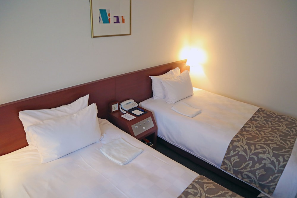 ツインルーム シングルベッド 2 台 喫煙可 客室1 | からすま京都ホテル