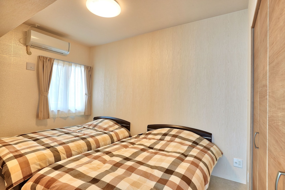 ファミリー ルーム 3 ベッドルーム 客室1 | マンゴーリゾート沖縄北谷