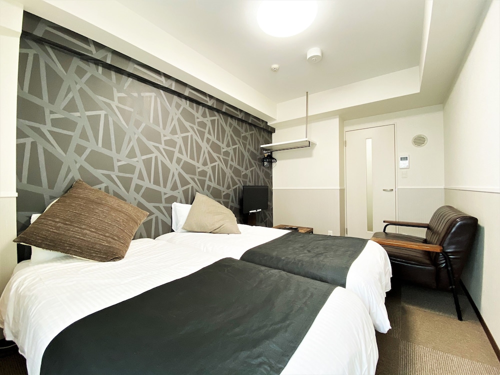 コンフォート ツインルーム シングルベッド 2 台 禁煙 リバービュー 客室1 | ランドーホテル福岡