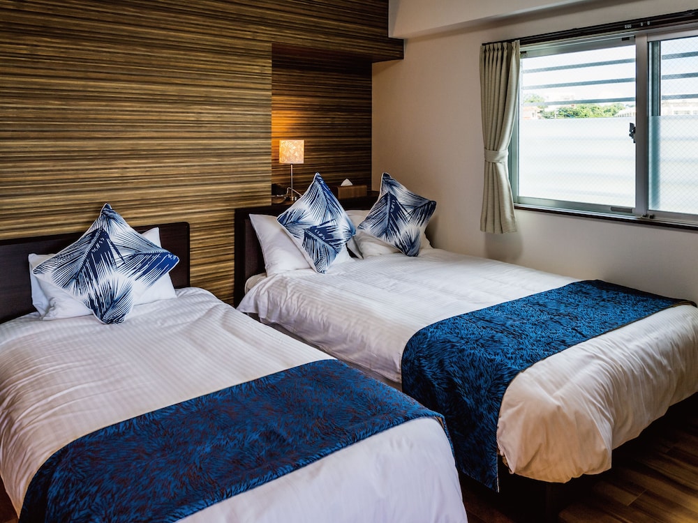 ウイングデラックスツイン(2階 41.4平米 1LDK) 客室2 | ザ・サンセットビレッジ沖縄北谷