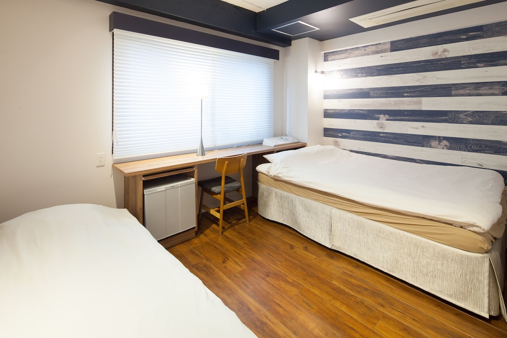 ダブルルームダブルサイズベッド 1 台ソファーベッド付き 客室4 | シティ ホテル N.U.T.S.