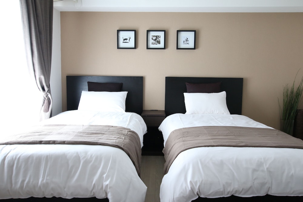 心地よいアパートメント 1ベッドルーム バルコニー付 (2B) 客室1 | KIKU'S ROOM