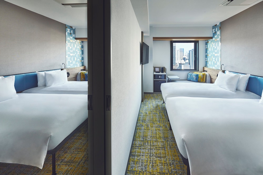 プレミアム ルーム ベッド (複数台) (High Floor, Free Breakfast) 客室1 | ホリデイ・イン エクスプレス大阪シティセンター御堂筋 by IHG