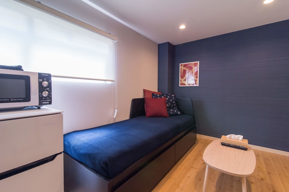 ロフト (103) リビング エリア0 | テン アパートメント ホテル