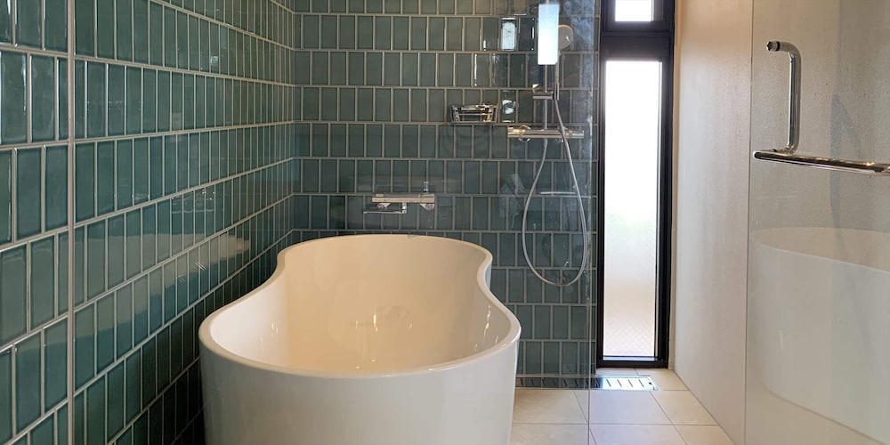 ベーシック ツインルーム ベッド (複数台) バスルーム0 | よみたんコンドホテル ND