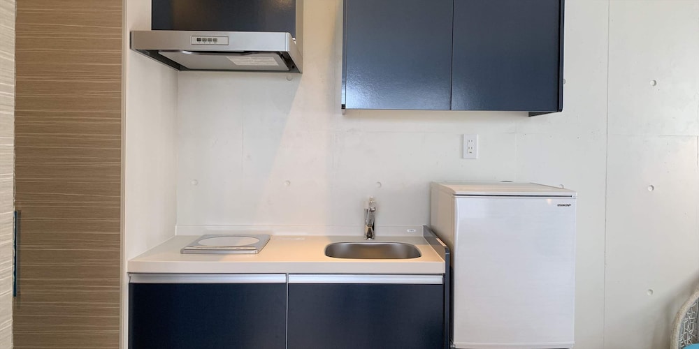 ベーシック ツインルーム ベッド (複数台) 専用キッチン0 | よみたんコンドホテル ND