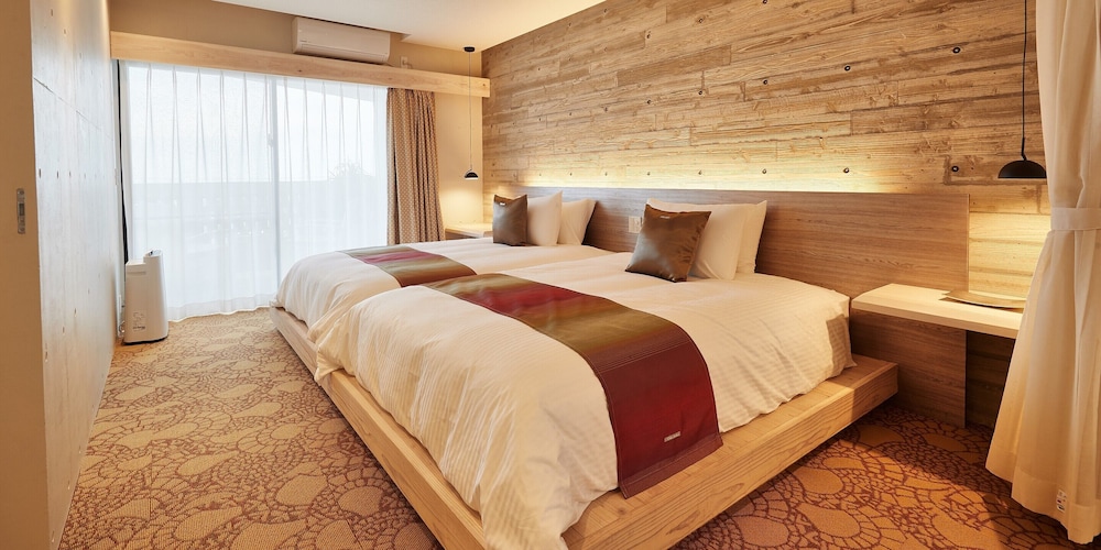 デラックス ツインルーム ベッド (複数台) 客室1 | よみたんコンドホテル ND