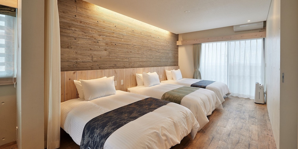 トリプルルーム ベッド (複数台) 客室2 | よみたんコンドホテル ND