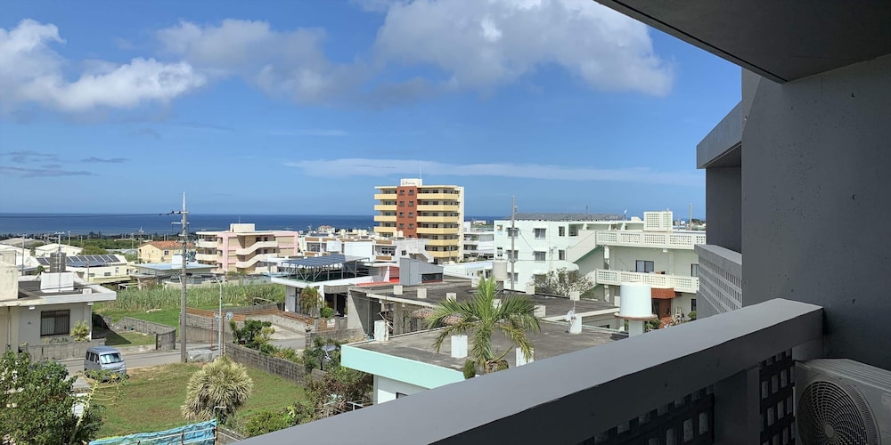 デラックス ツインルーム ベッド (複数台) バルコニーからの眺望0 | よみたんコンドホテル ND