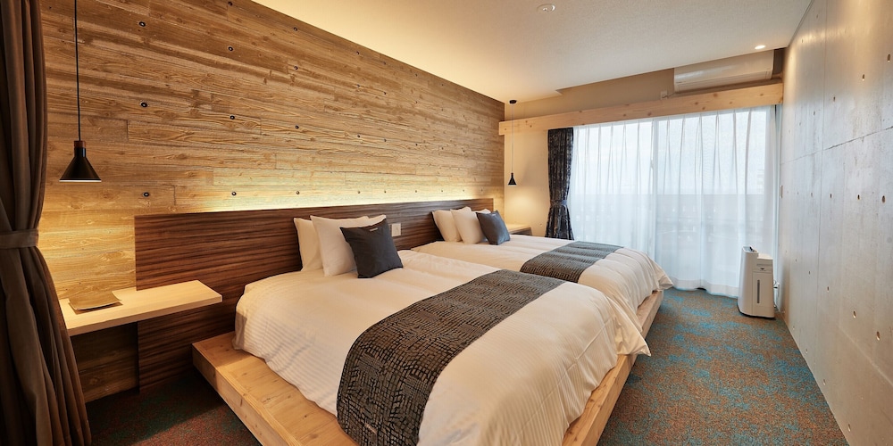 デラックス ツインルーム ベッド (複数台) 客室0 | よみたんコンドホテル ND