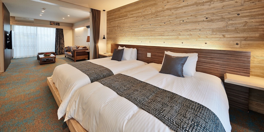 デラックス ツインルーム ベッド (複数台) 客室2 | よみたんコンドホテル ND