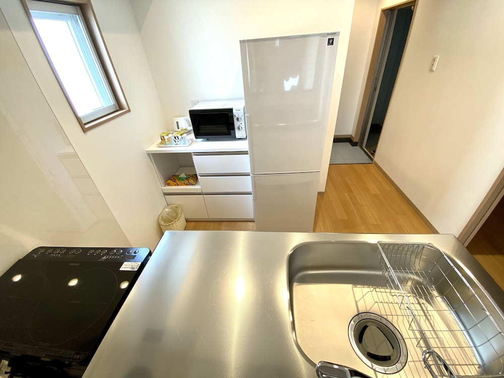 デラックス ルーム ダブルベッド 2 台 専用キッチン0 | M's Stay Okinawa