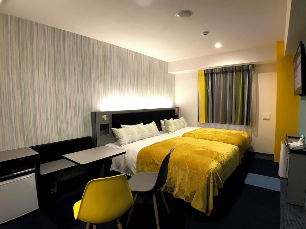 ツインルーム セミダブルベッド2台 禁煙 (A) | グリーンリッチホテル沖縄名護 人工温泉・二股湯の華