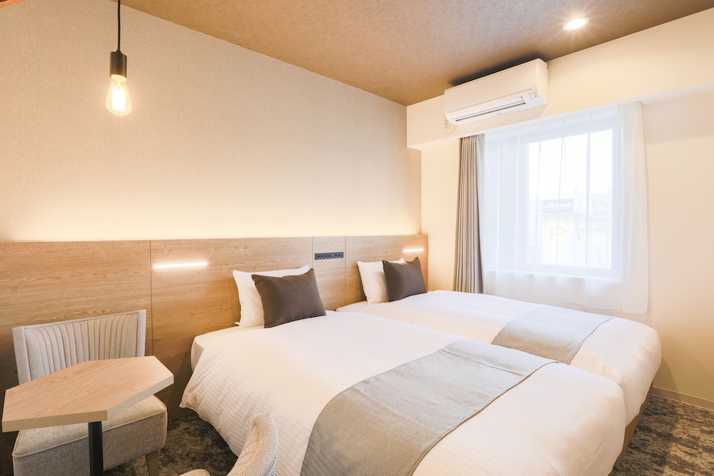 【禁煙】ハリウッドツインルーム/16㎡/110 ㎝ 幅ベッド2台/2名迄 | KOKO HOTEL 札幌すすきの