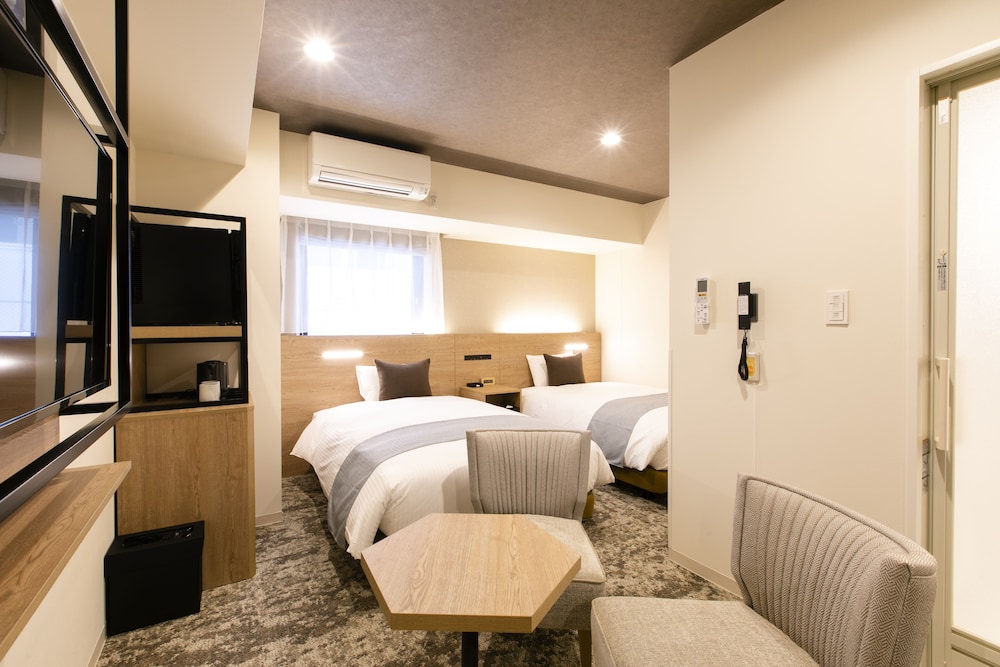 【禁煙】ユニバーサルツインルーム/26㎡/120 ㎝ 幅ベッド2台/2名迄 客室2 | KOKO HOTEL 札幌すすきの